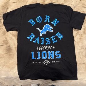 BORN X RAISED Tee in Black with Vibrant Blue Design